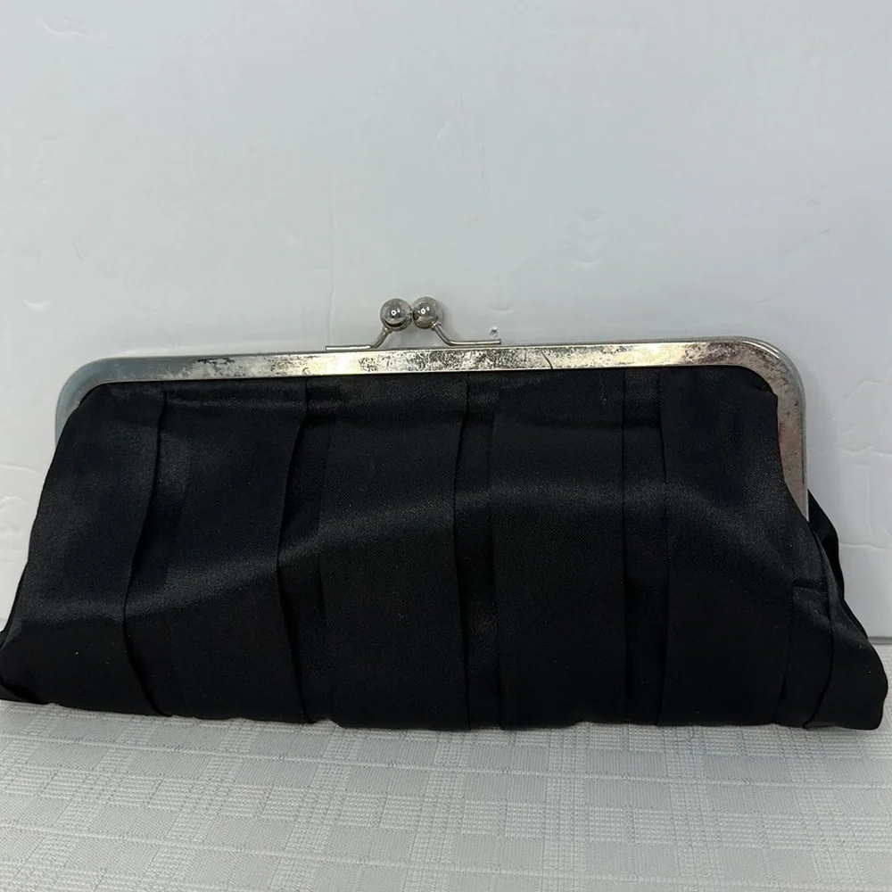 Carolina Herrera kiss lock black and silver clutch